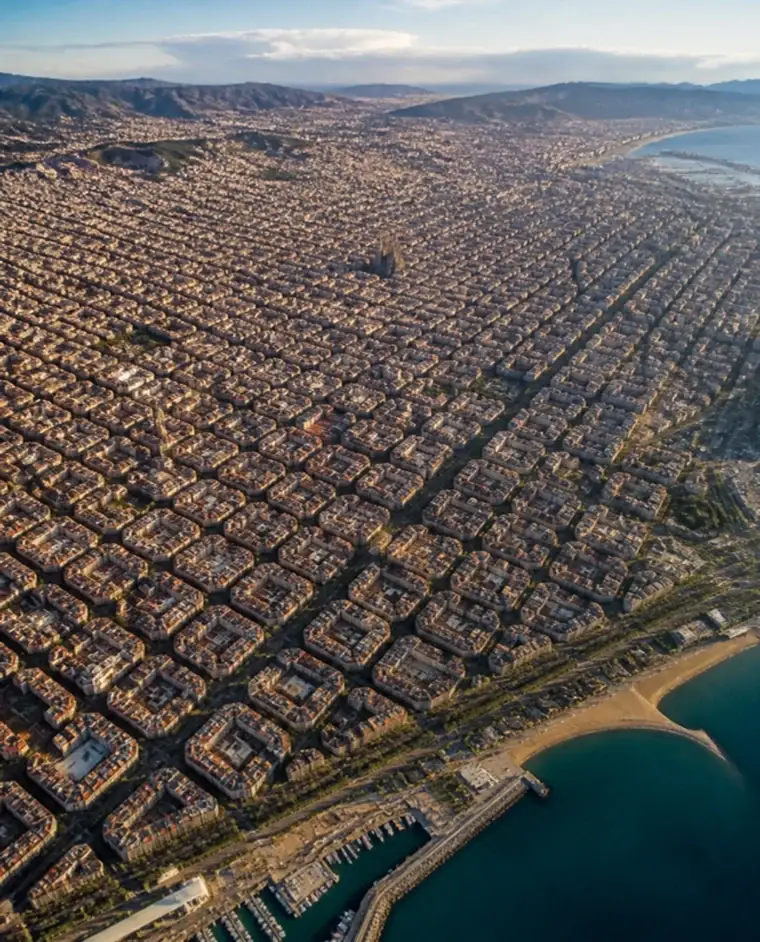 Vista aérea de Barcelona, com as quadras planejadas do Eixample até o mar